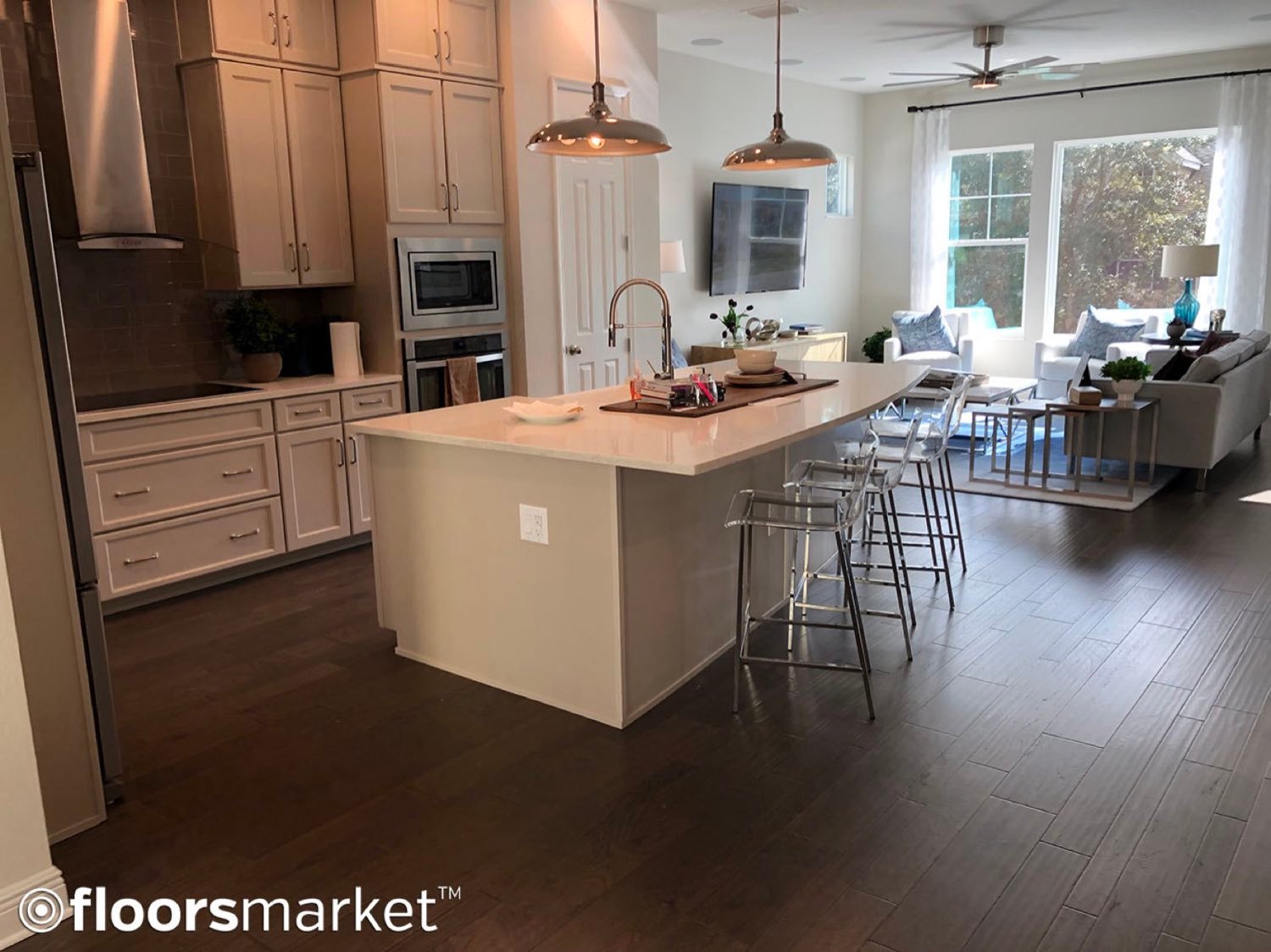 Wide-plank luxury vinyl plank flooring in an open kitchen and dining area, Riverview FL